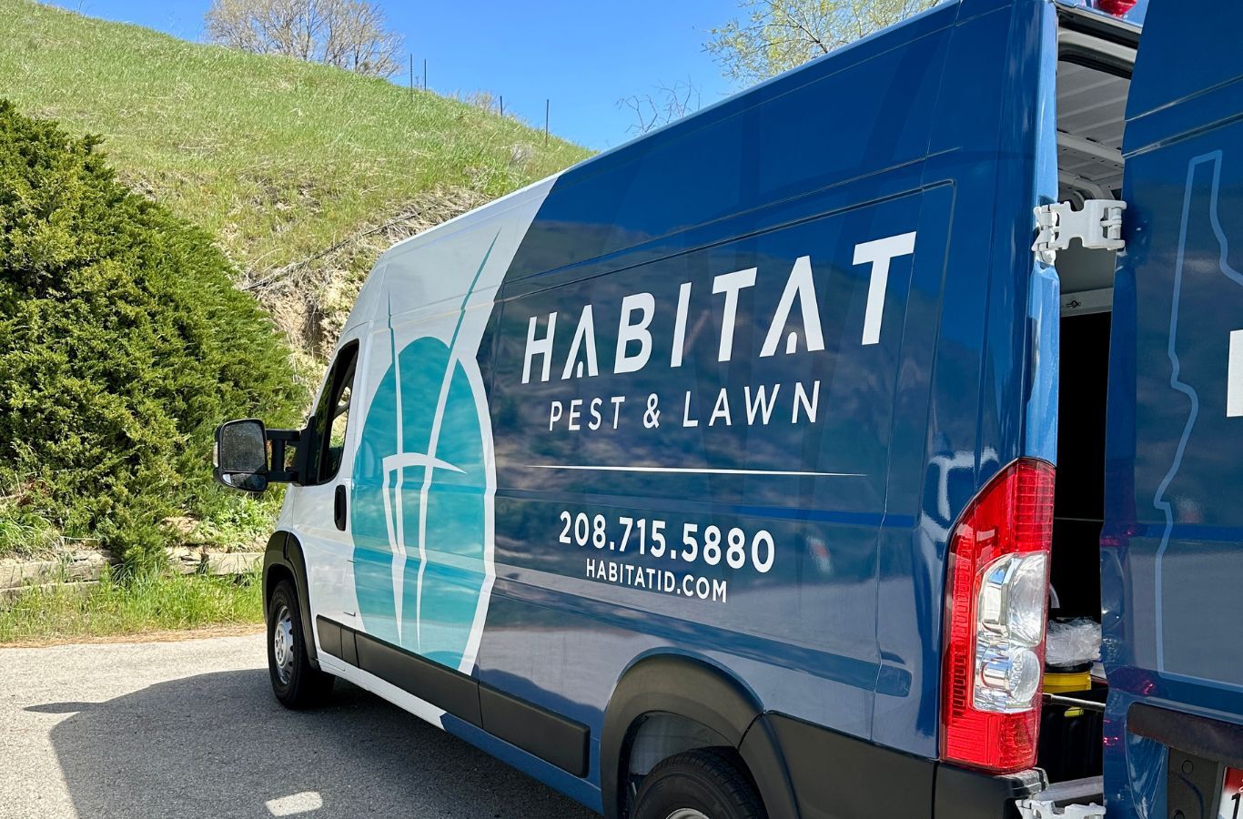 A Habitat Pest & Lawn professional inspecting a Melba, ID home for rodent activity, using expert tools for safe and effective pest control.